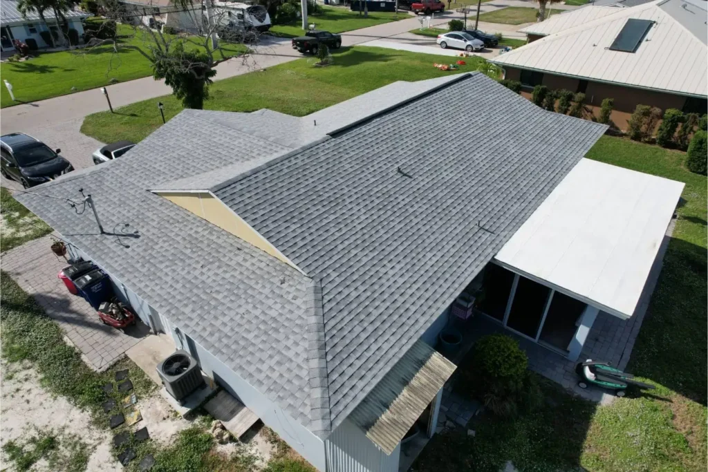 Drone view of a complete residential asphalt shingle roof replacement in Lee County, showcasing high-quality, storm-resistant craftsmanship by Legrand's Roofing.