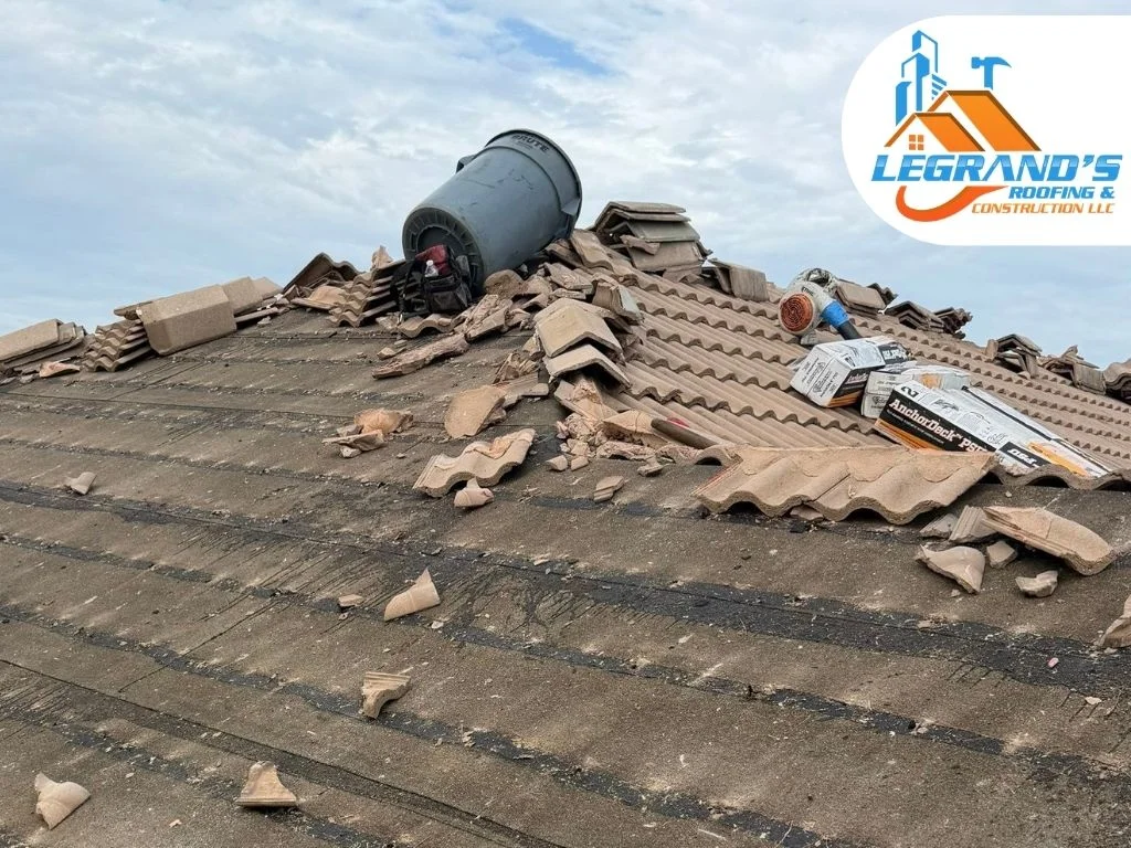 Water-damaged roof decking and torn underlayment from delayed roofing maintenance.